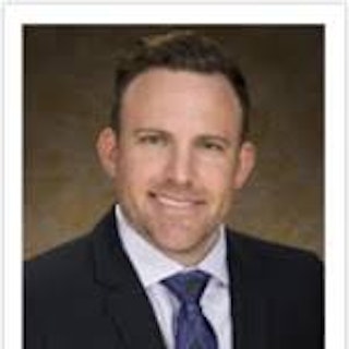 Travis M, MD